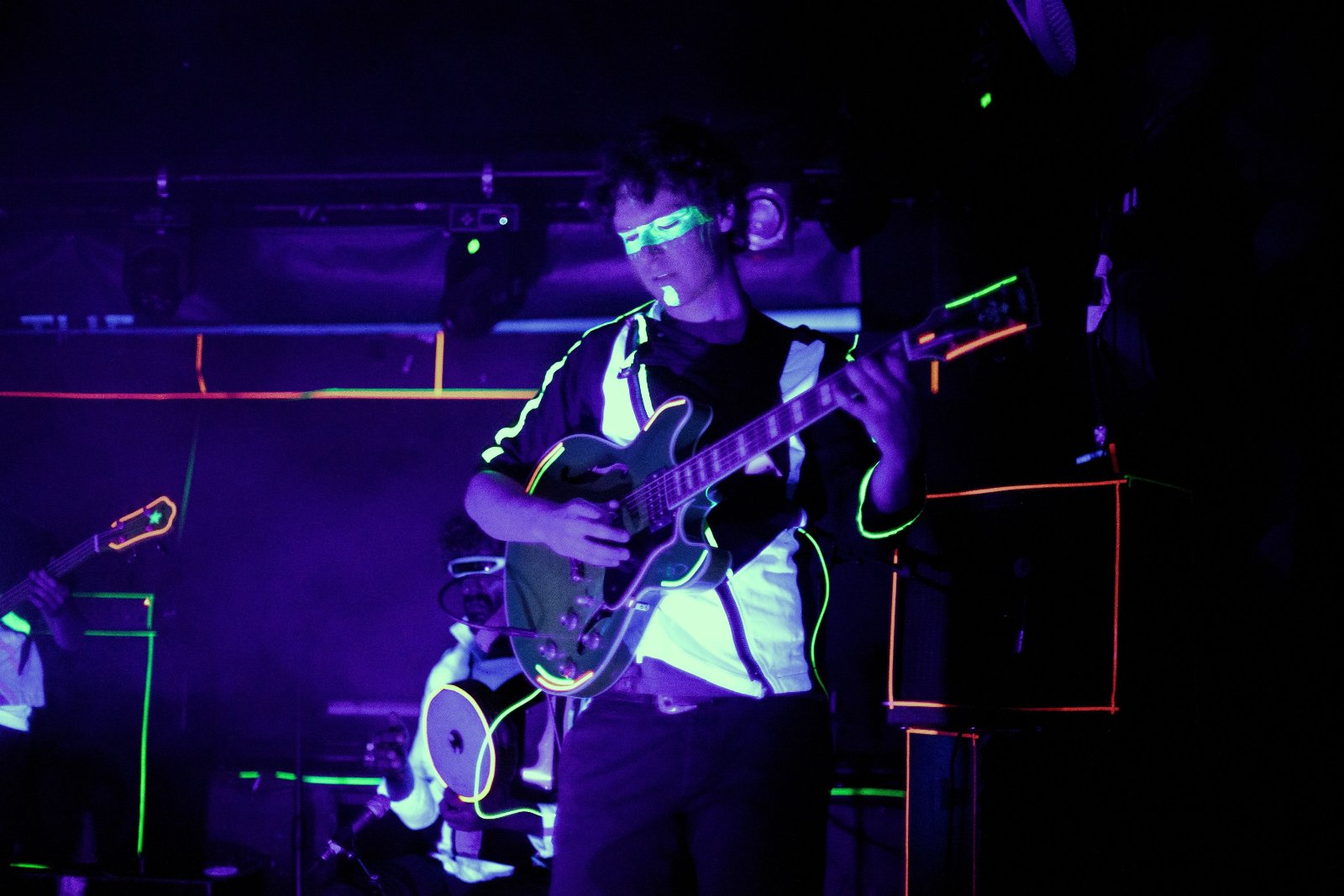 Charis Karantzas on guitar, backlit