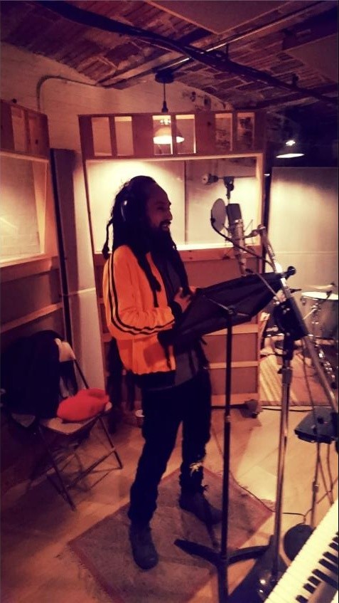 Guest vocalist tracking vocals in a New York studio